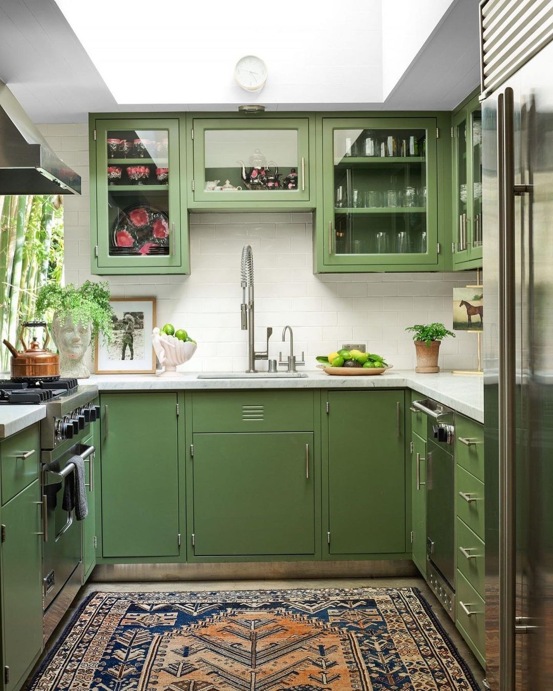 Green U-Shaped Kitchen With Glass Upper Cabinets