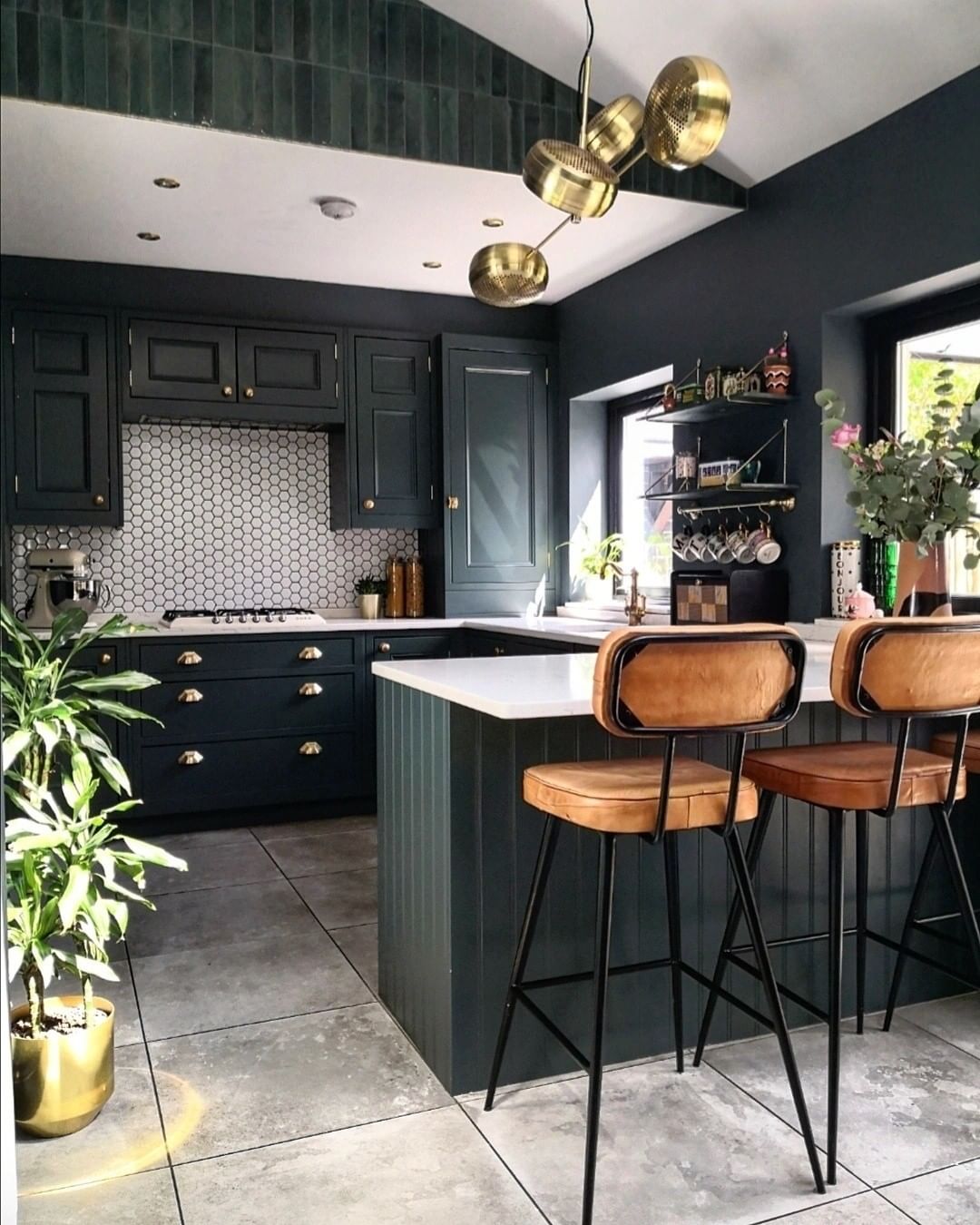 Rich Dark Green Cabinets For A U-Shaped Kitchen With Banquette Seating