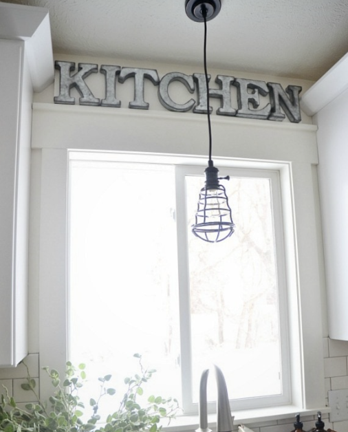 Farmhouse Window With Industrial Lighting In Kitchen