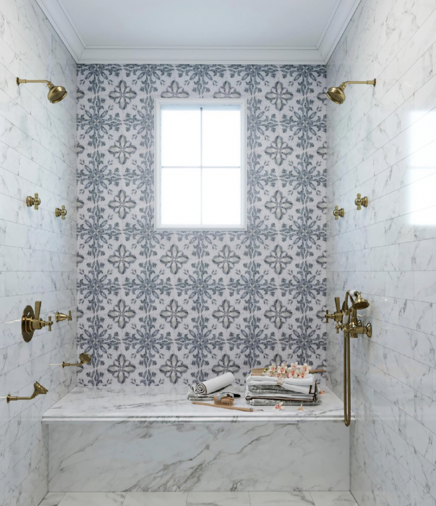 Floral Tile Accent wall For Shower With Gold Harware And Marble Bench