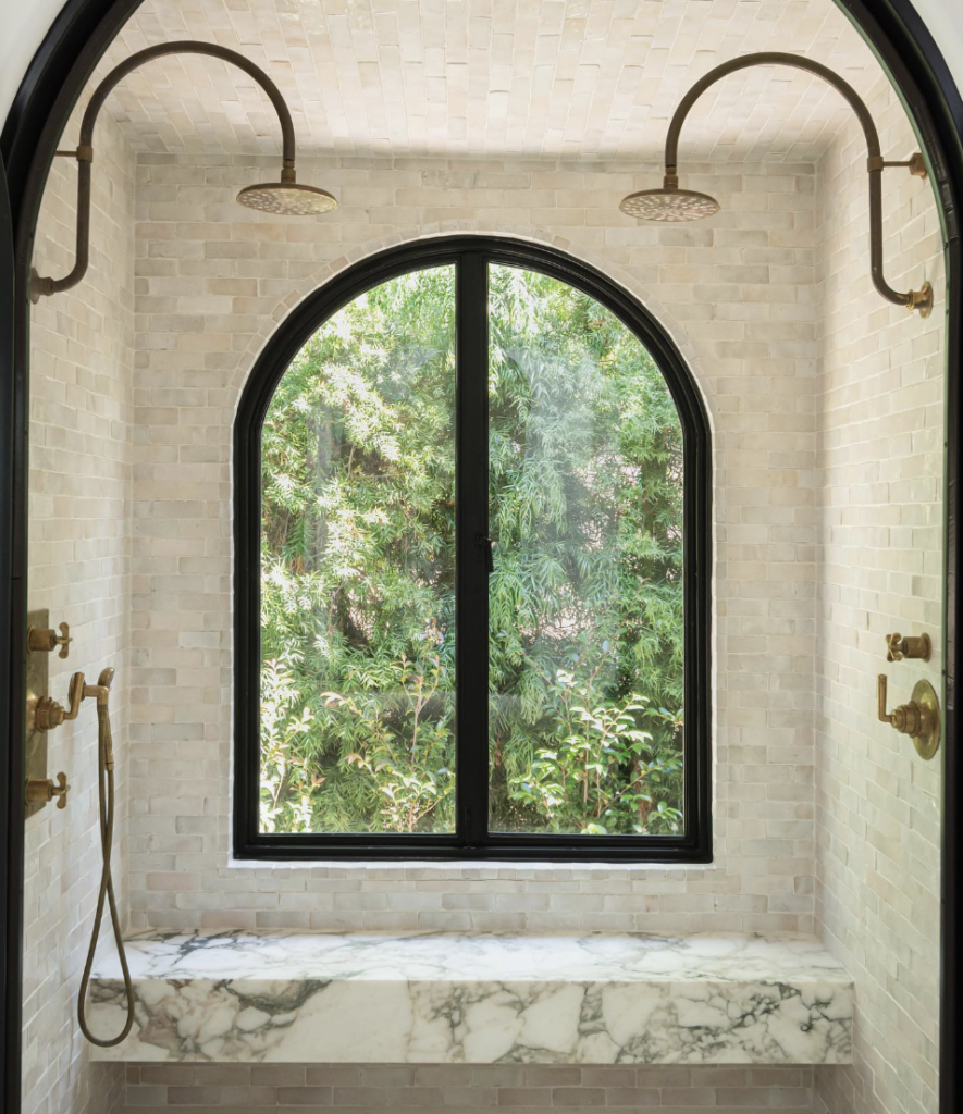 Beige Shower Tiles With Large Black Arched Window