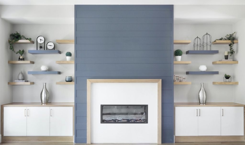Blue Accent Wall Floor-To-Ceiling Fireplace With Floating Shelves On Both Sides
