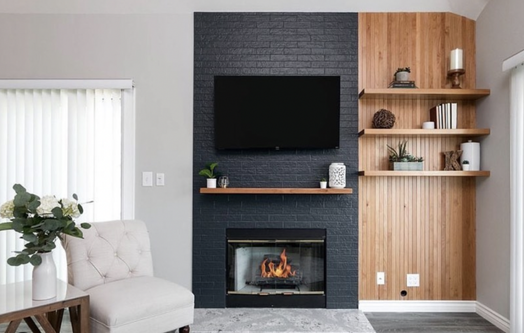 Black Accent Wall Brick Fireplace With Wooden Paneling On One Side