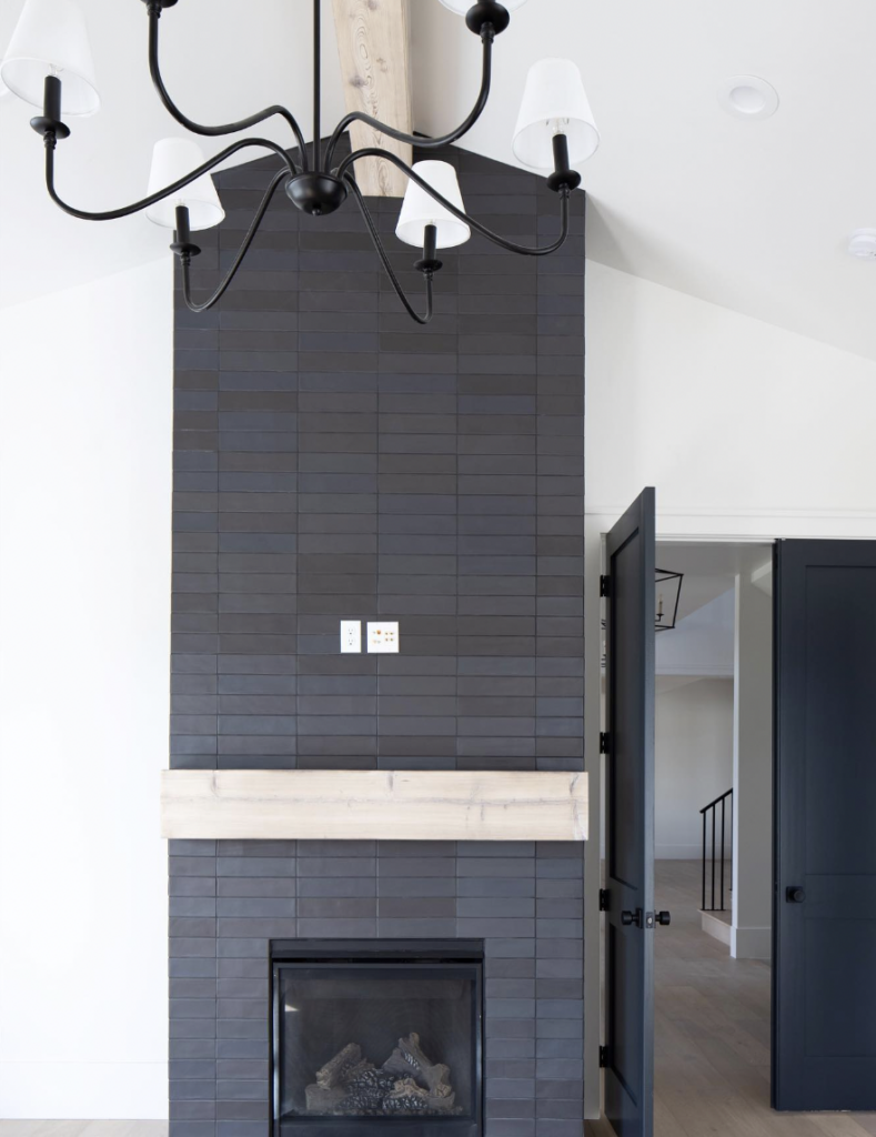 Black Fireplace White Walls And Wooden Beams