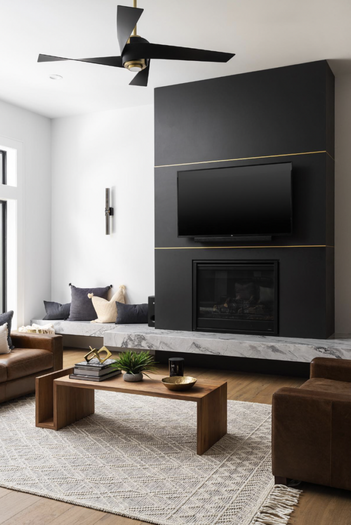 Black Fireplace Wall With Gold Accents