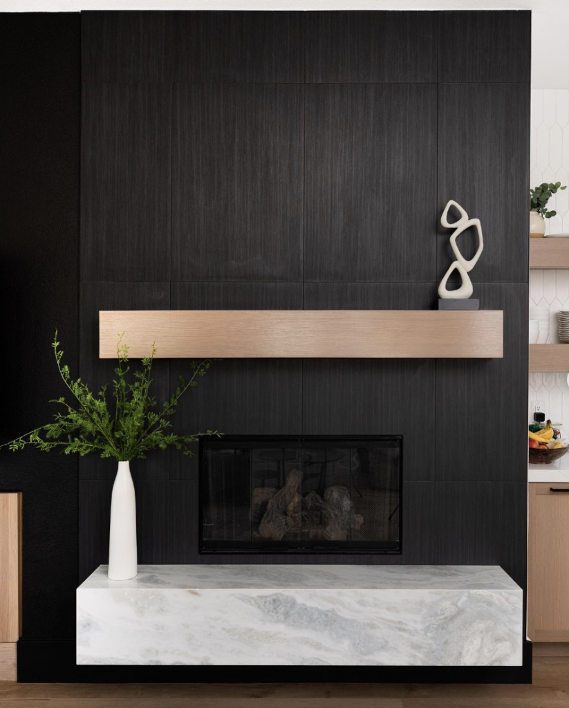 Black Fireplace With Wood And Marble Floating Shelves