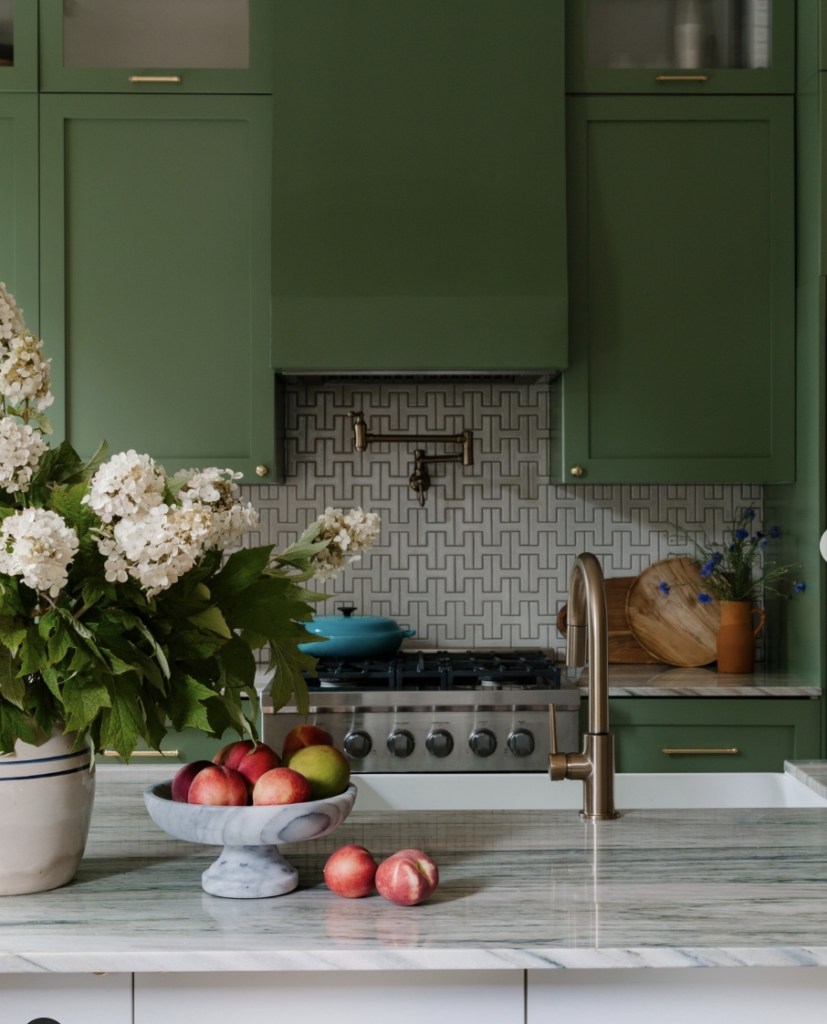 Green Kitchen With Grey Tile Behind The Stove