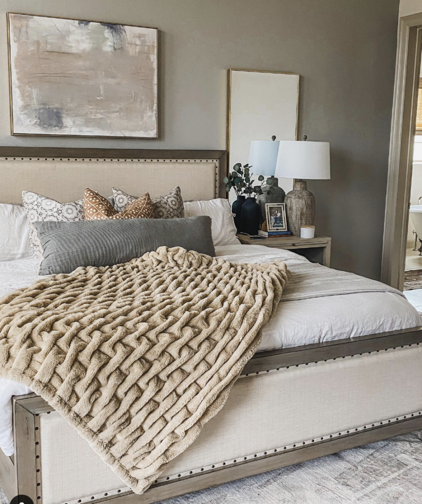 Neutral Color Bedroom Decor With Gold Frame Mirror Behind Nightstand 