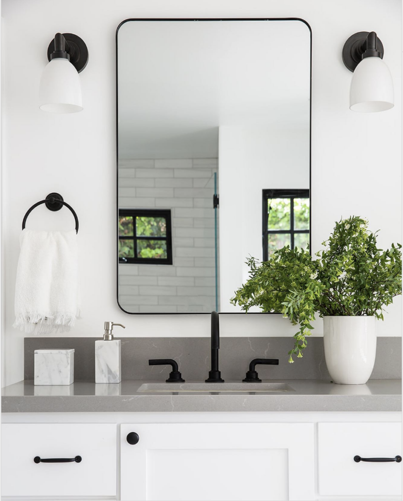 Powder Room With Black Hardware And Grey Countertop