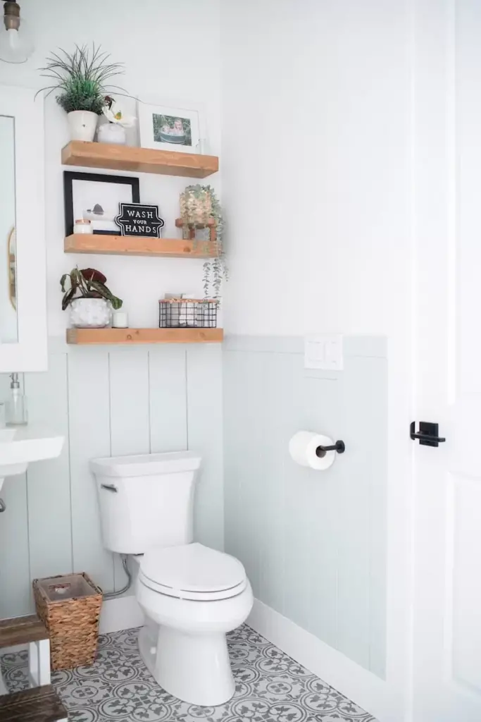 Light Blue Shiplap Half Bathroom With Wooden Floating Shelves