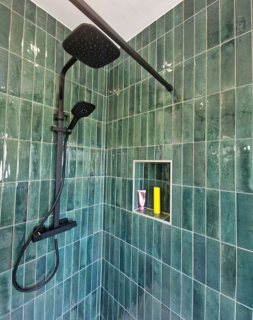 Green Tiles With Black Bathroom Features