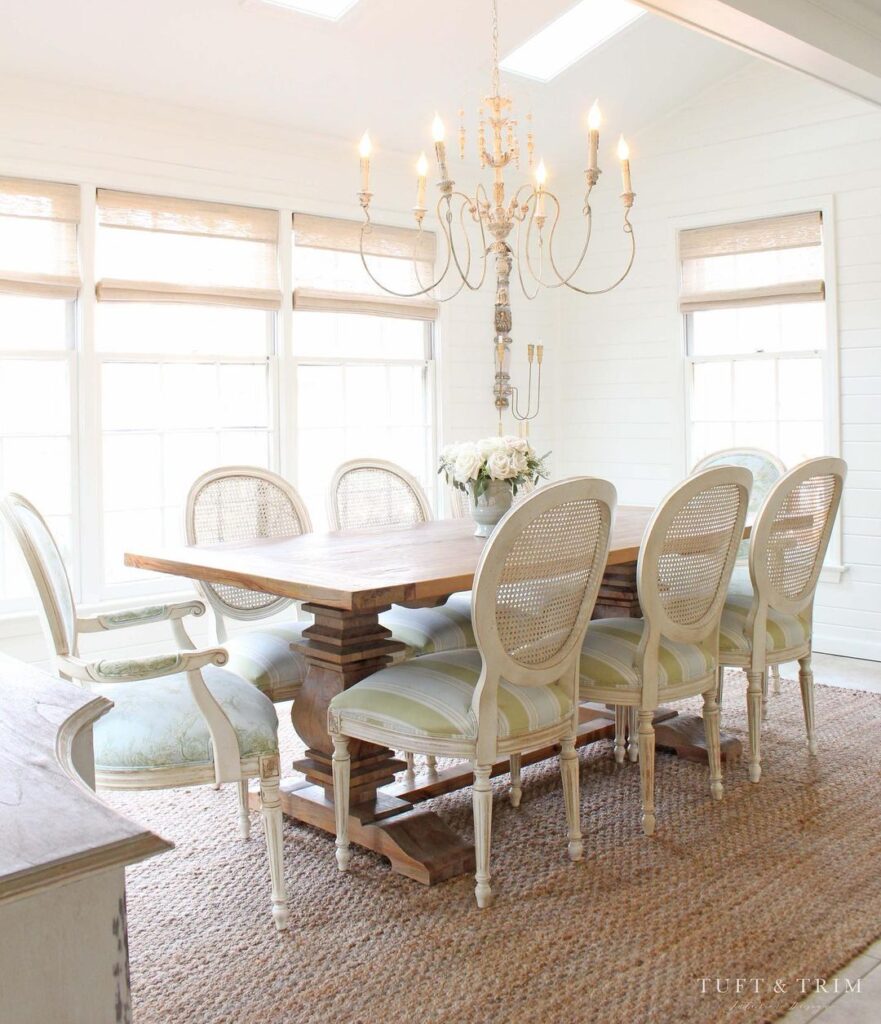Jute Dining Room Rug For A Wooden Table And White Chairs