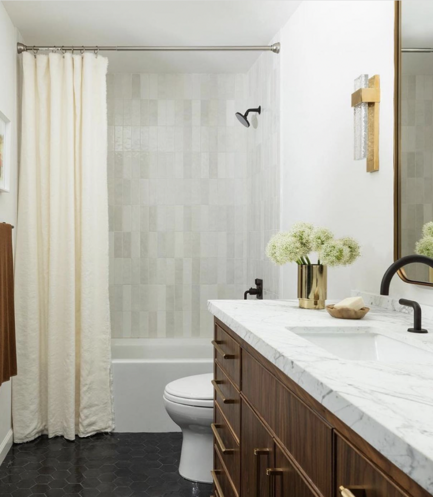 White Vertical Tile Bathroom With Wooden Vanity