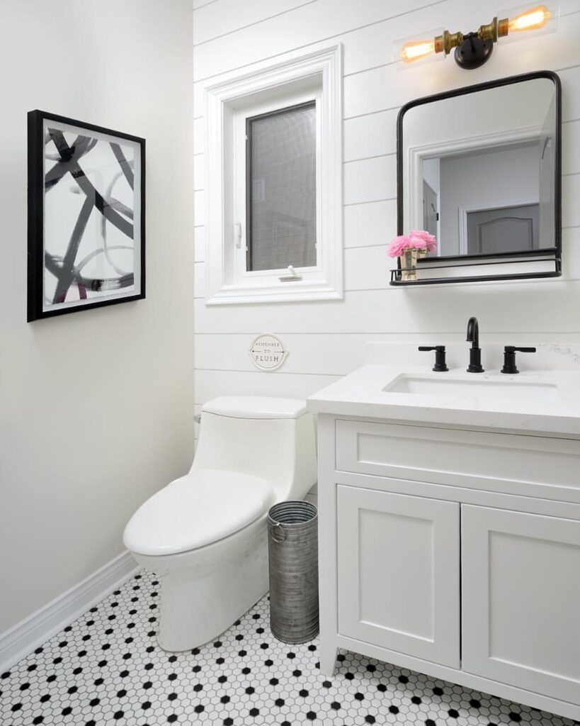 White Shiplap In A Bathroom With Polka Dot Flooring