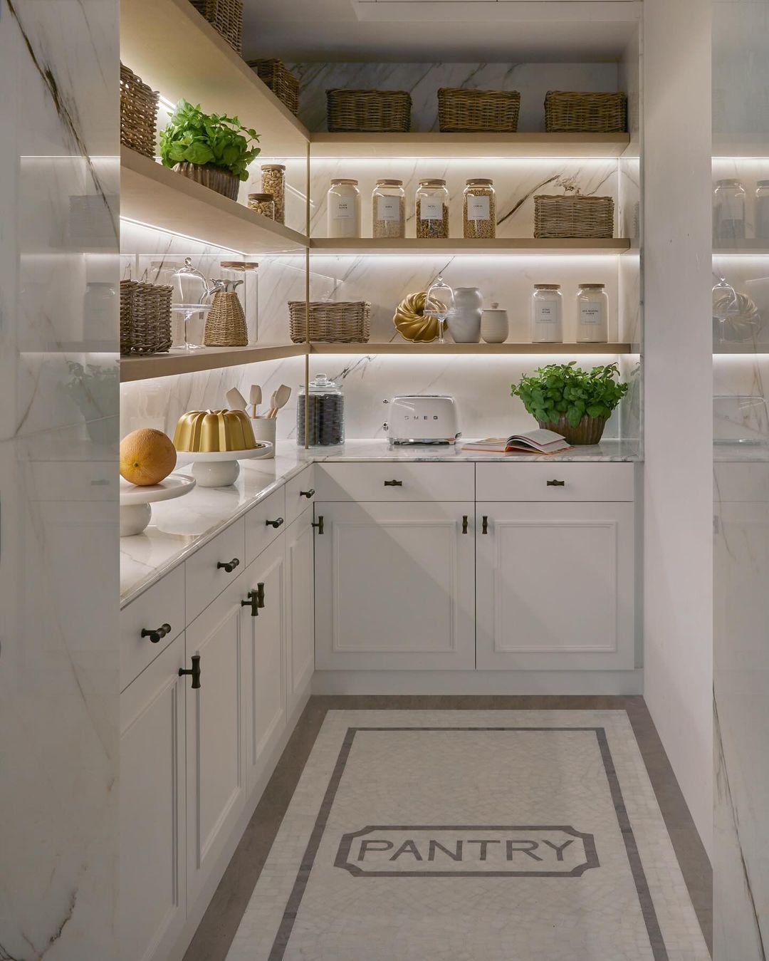 Organized Elegance: White Shaker Pantry with Bronze Hardware