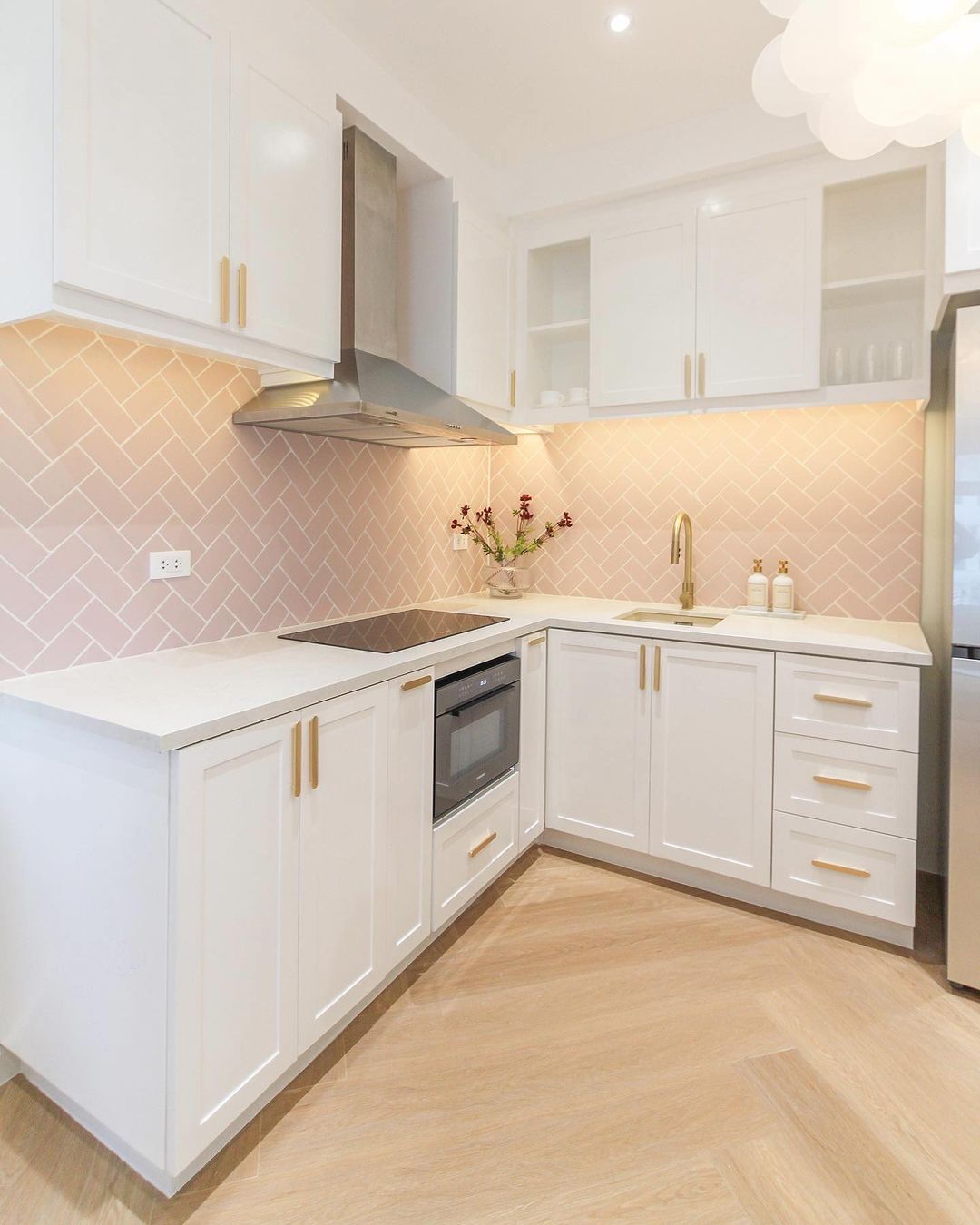 Sleek Elegance: White Shaker Cabinets with Golden Touches