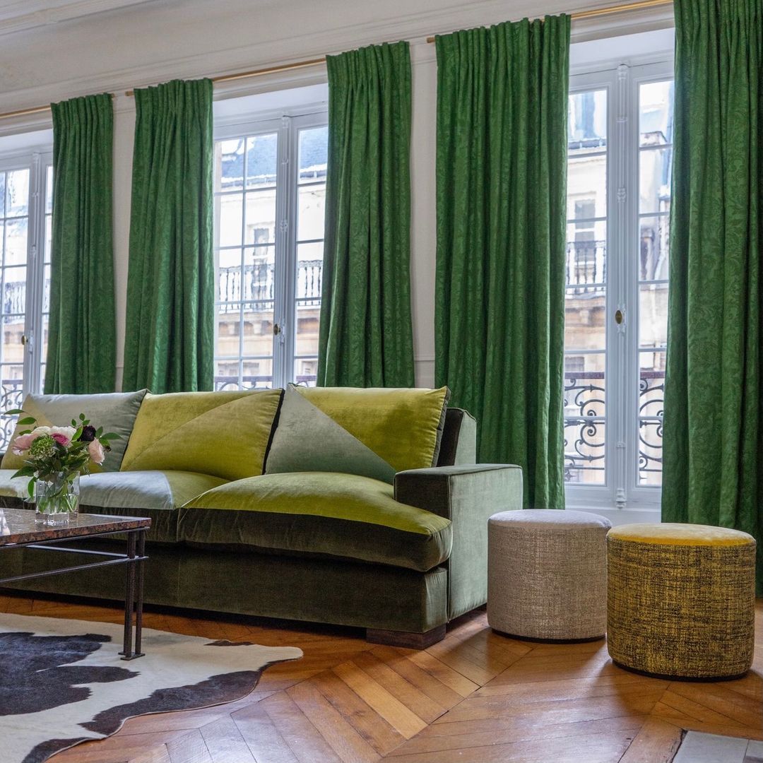 Urban Elegance with Velvety Greens and Chic Poufs