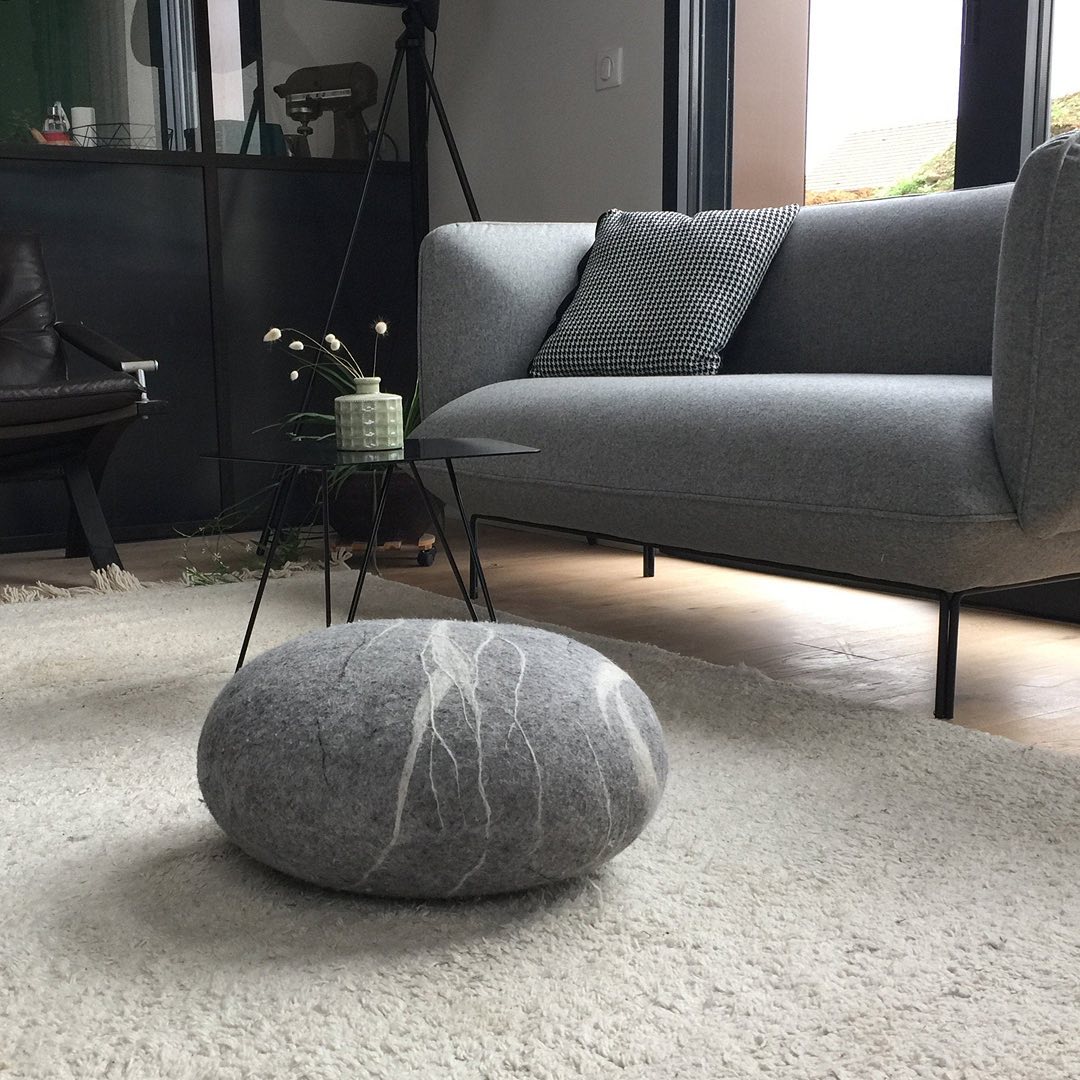 Minimalist Grey with a Rock-Inspired Pouf