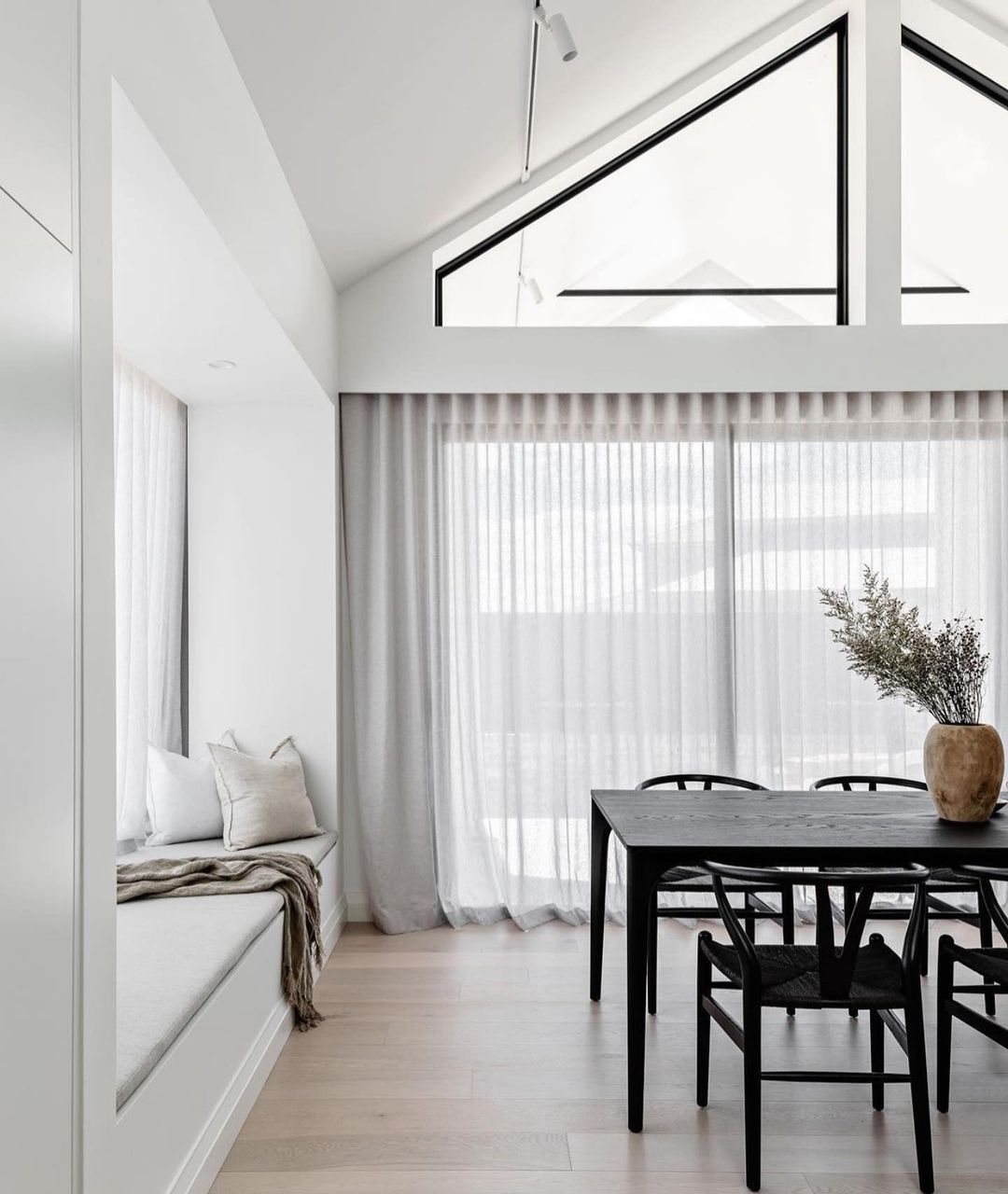 Modern Cathedral Ceiling in a Chic Dining Area