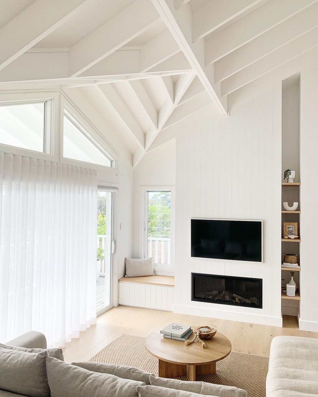 Bright Living Room with White Cathedral Ceiling