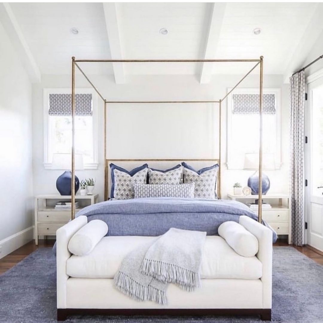 Elevate the Space with a Four-Poster Bed and Blue Accents