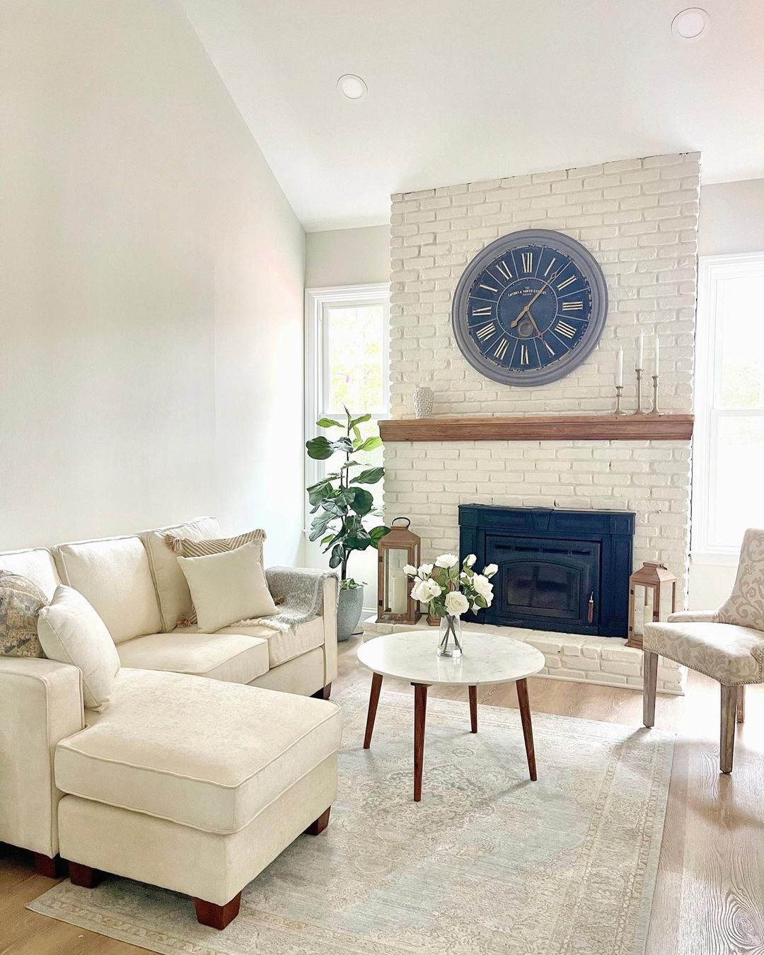 Clean and Contemporary: White Brick Fireplace with Oversized Clock