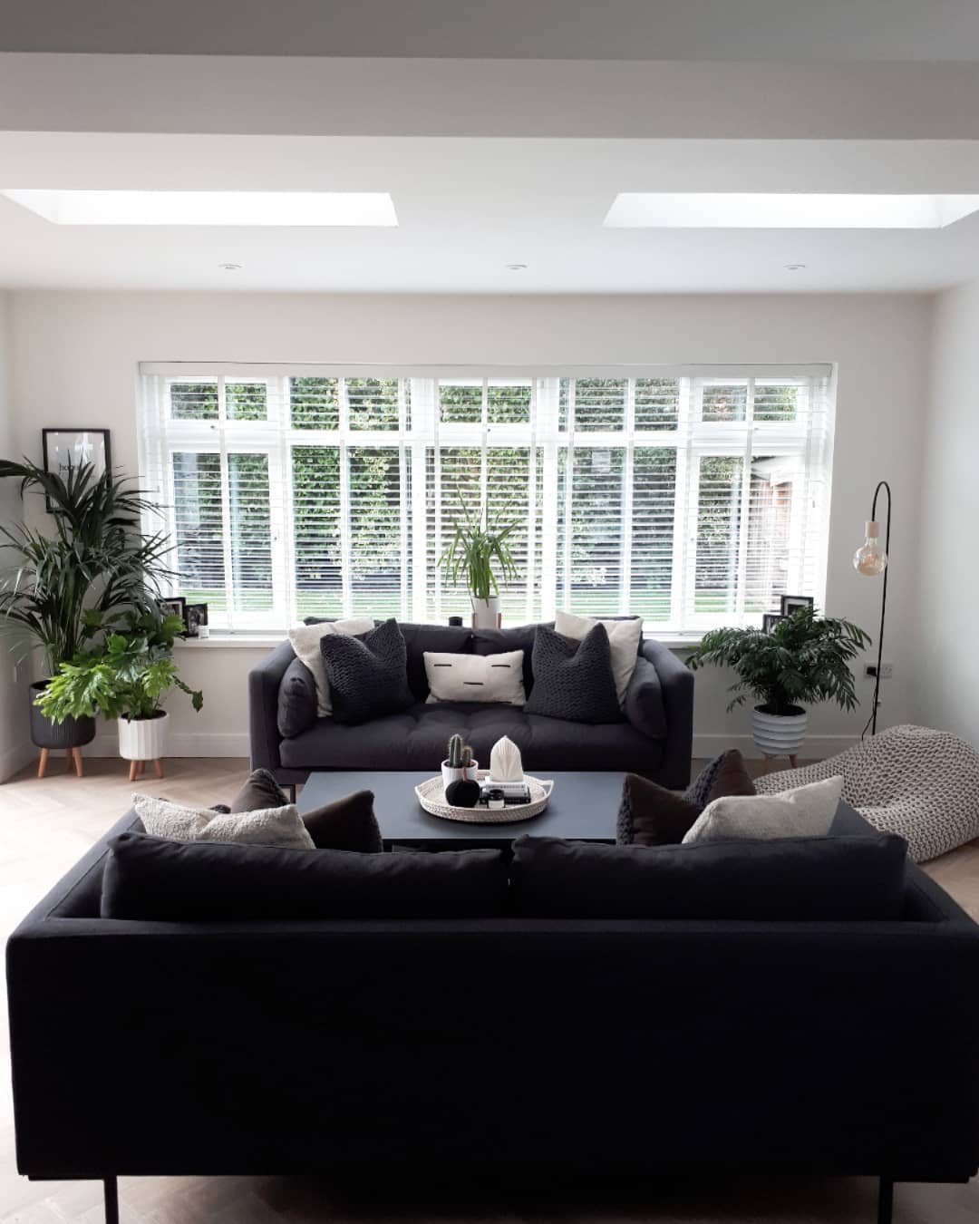 Black Couch in a Bright, Airy Room