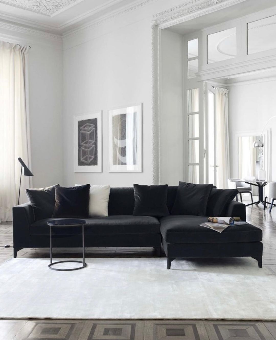 Black Couch in a Classic High-Ceiling Room
