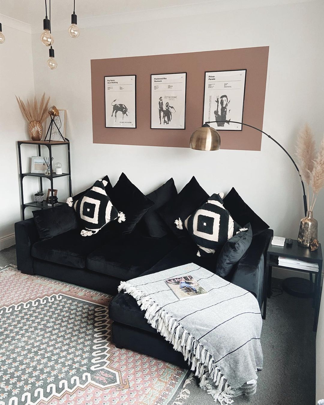 Black Couch with Eclectic Art and Textiles