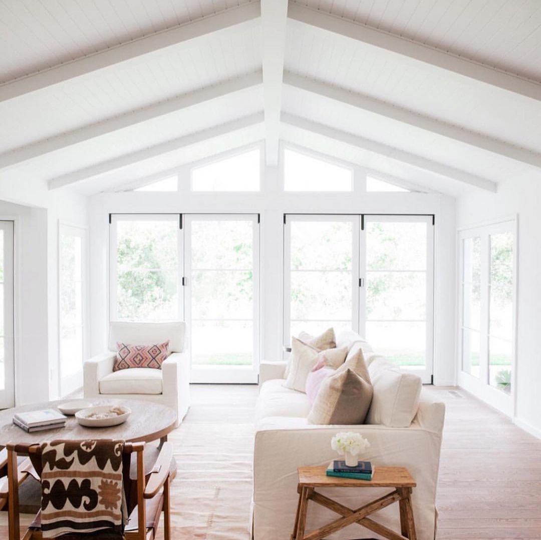 White Beams and Shiplap for a Spacious Living Area