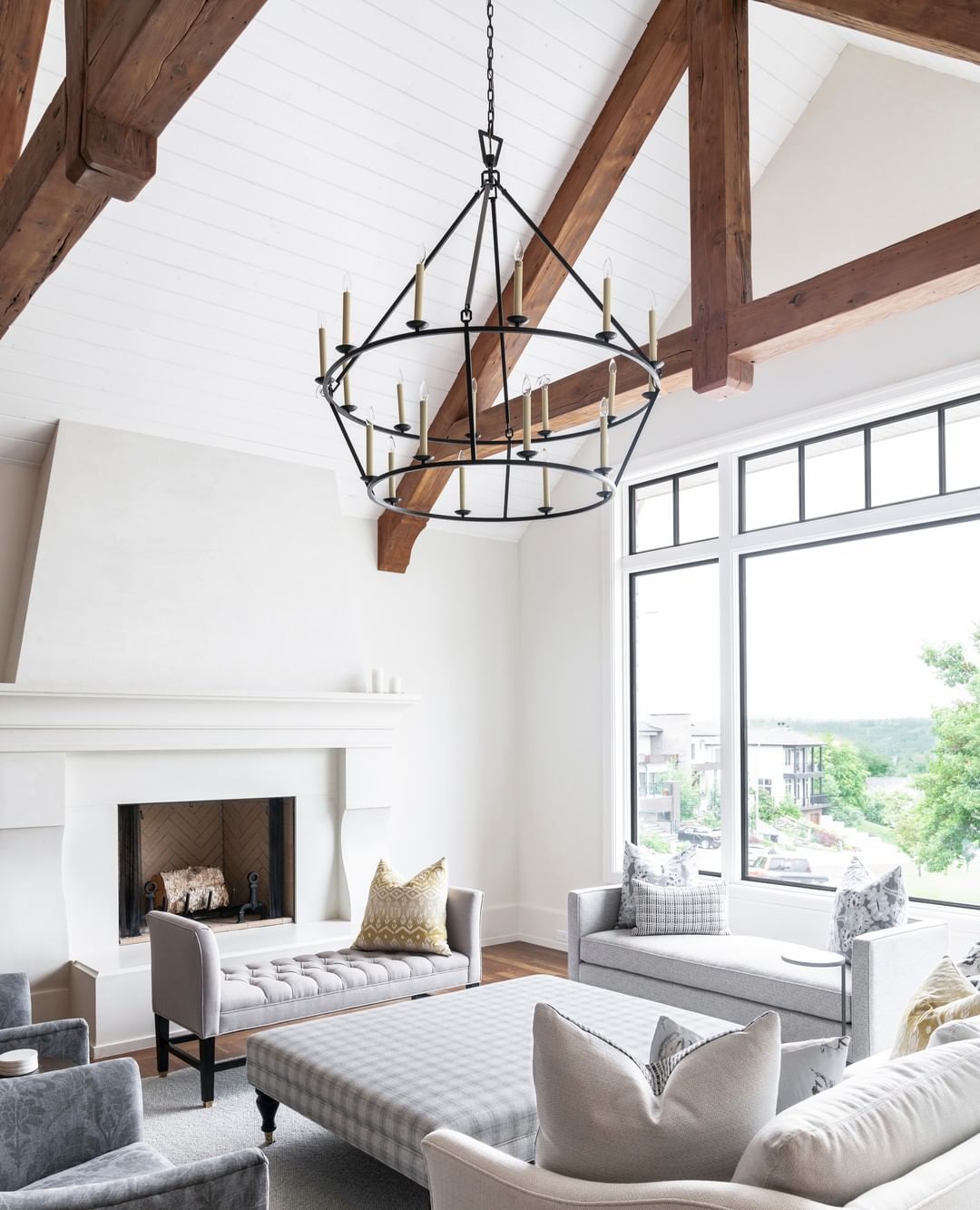 High Ceilings with Bold Wooden Beams and Elegant Shiplap