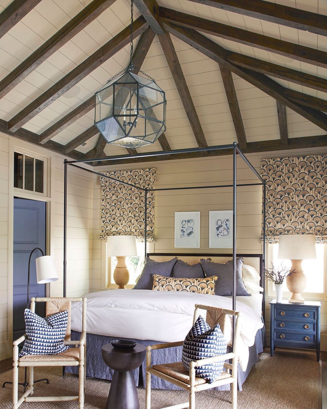 Cozy Bedroom Retreat with Dark Beams and Cream Shiplap Ceiling