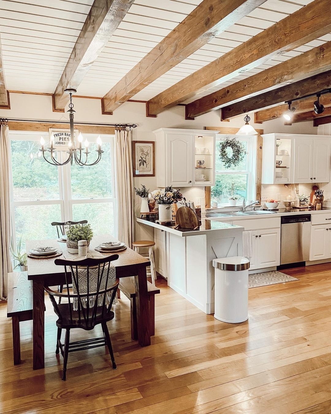 Warm Country Kitchen with Natural Wood Beams and Bright Shiplap