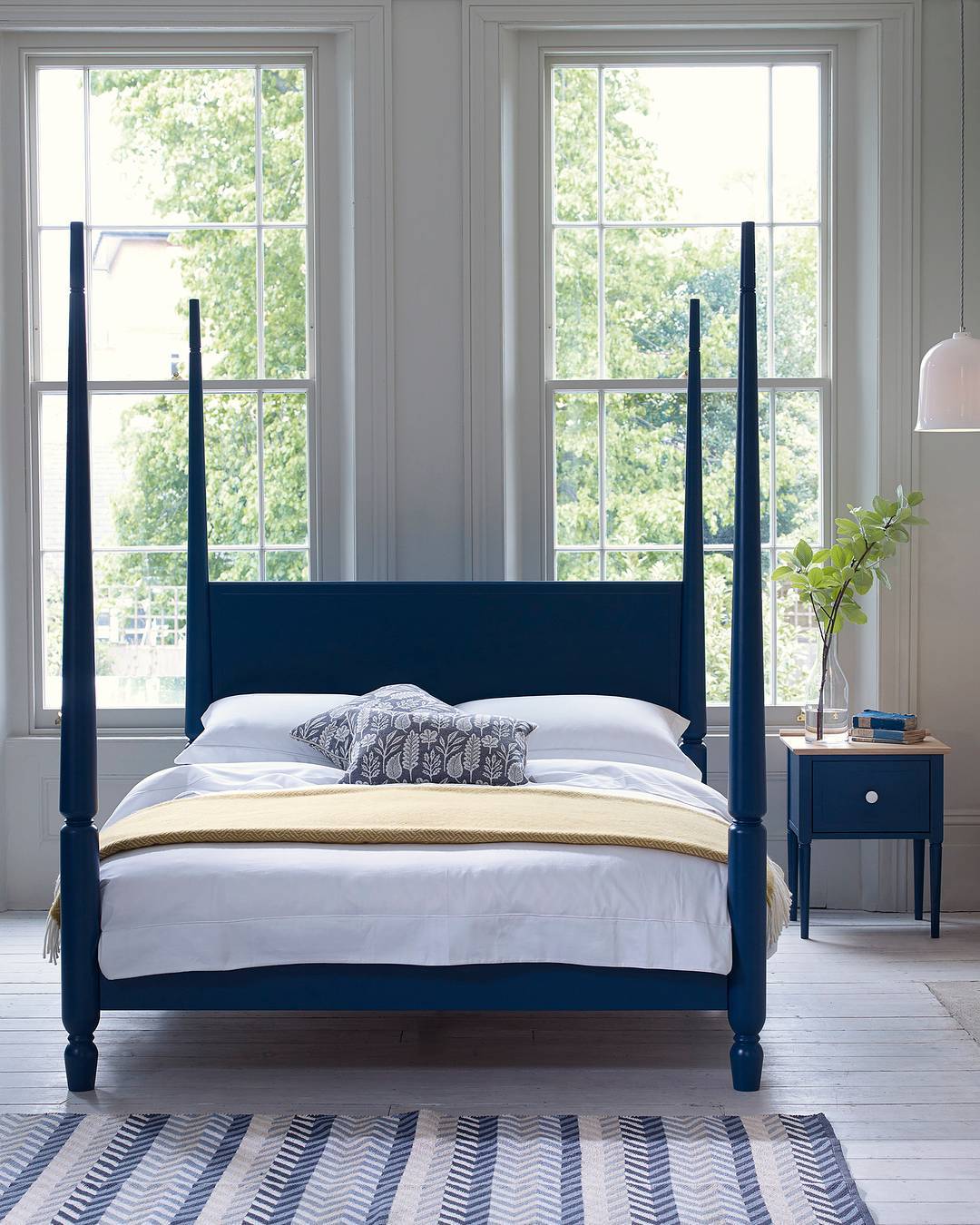 Modern Blue Four Poster Bed with Minimalist Decor