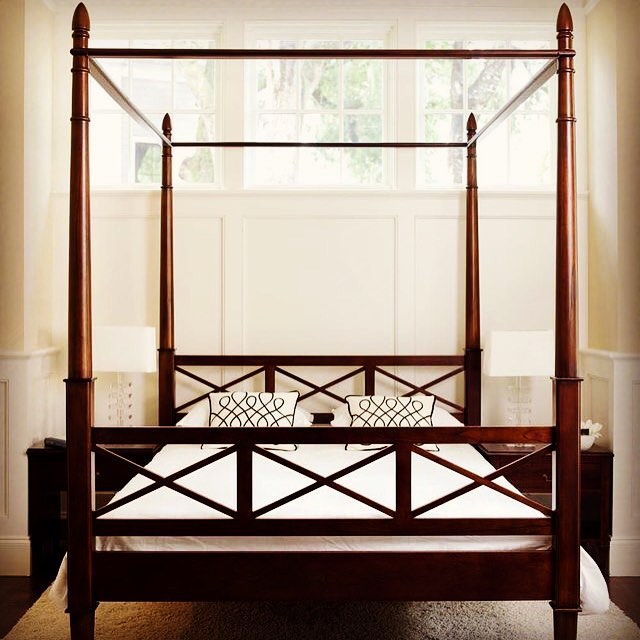 Classic Wooden Four Poster Bed with Geometric Design