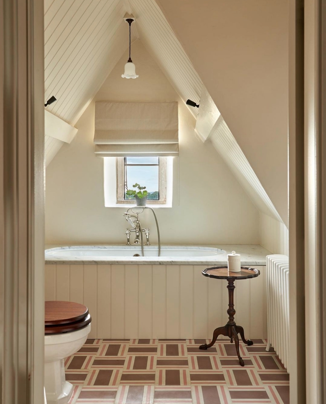 Charming Attic Bathroom with a Vintage Touch