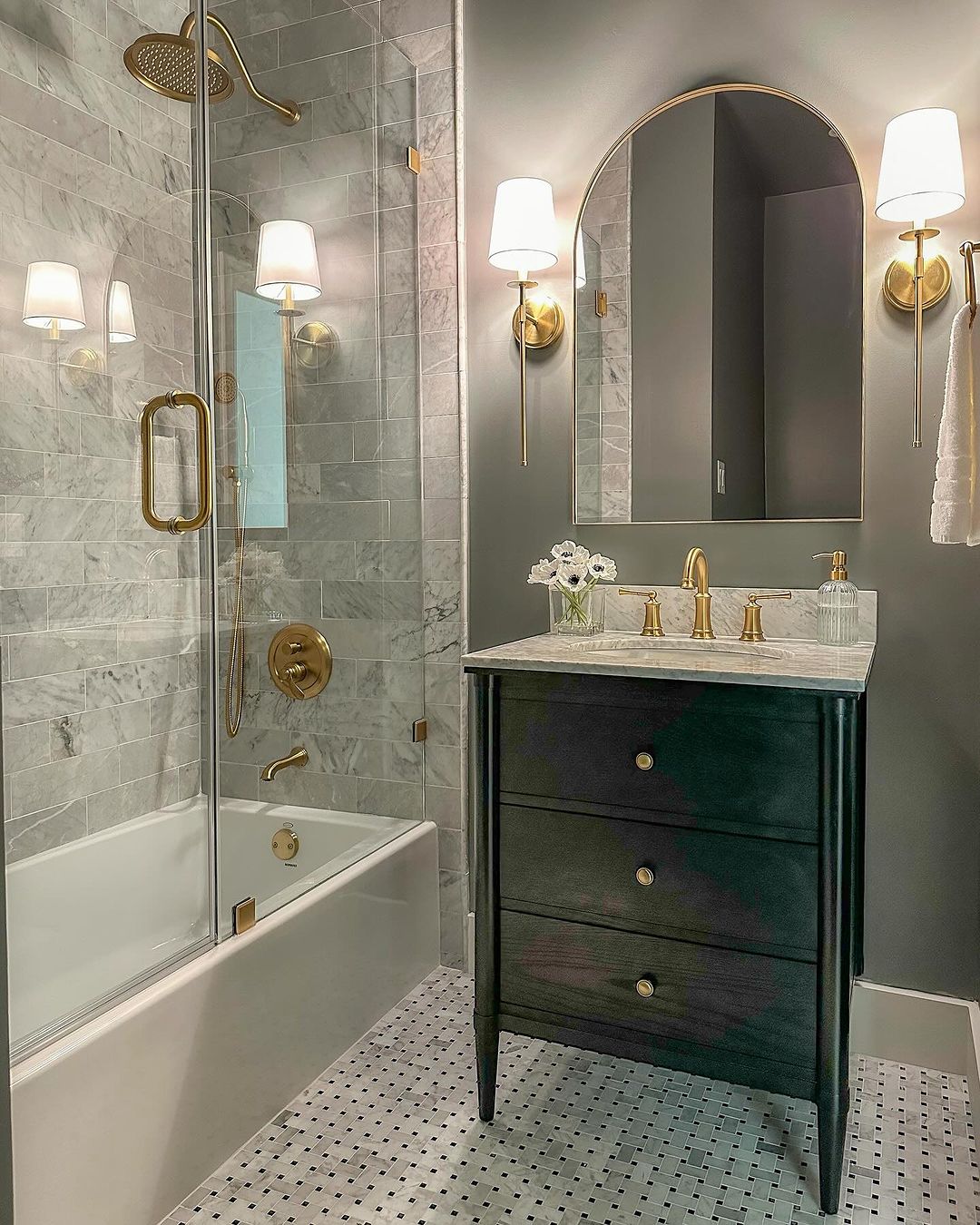 Luxurious Marble and Brass Accents in a Small Bathroom