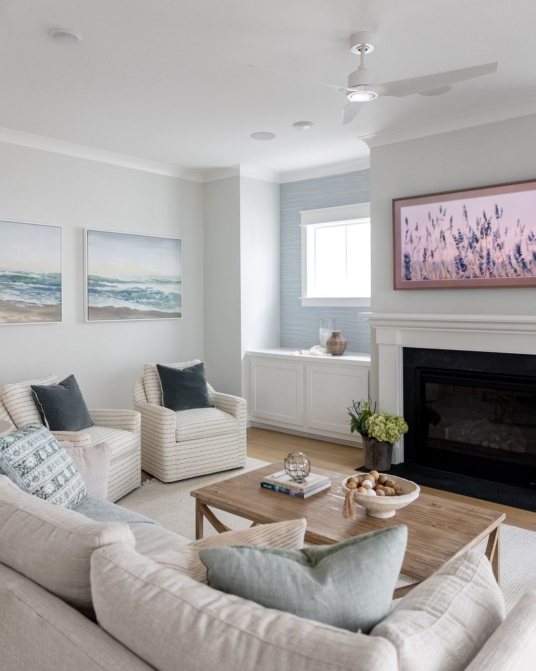Incorporate Coastal Art for a Serene Fireplace Setting