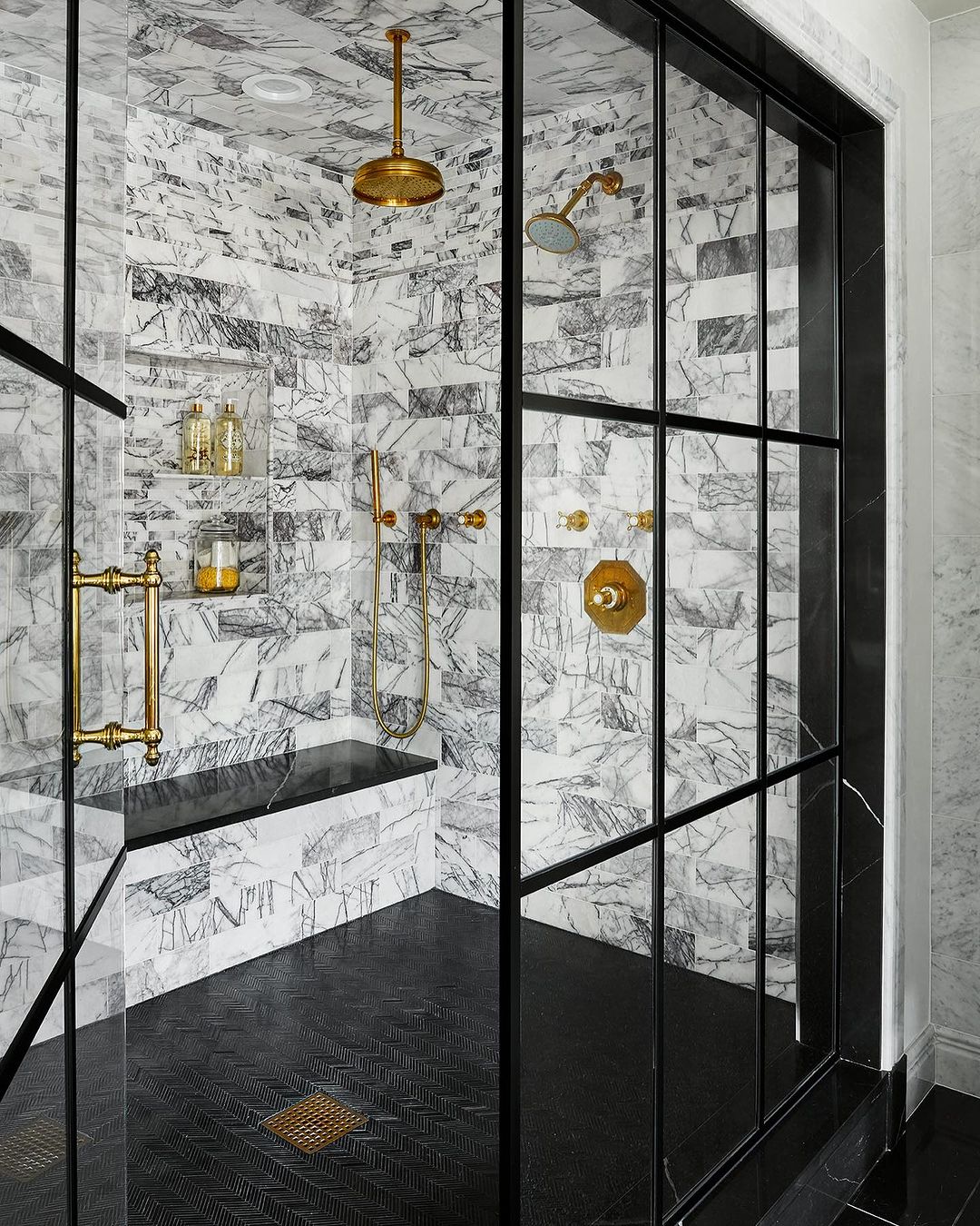 Luxurious Black and Gold Shower with Marble Niche
