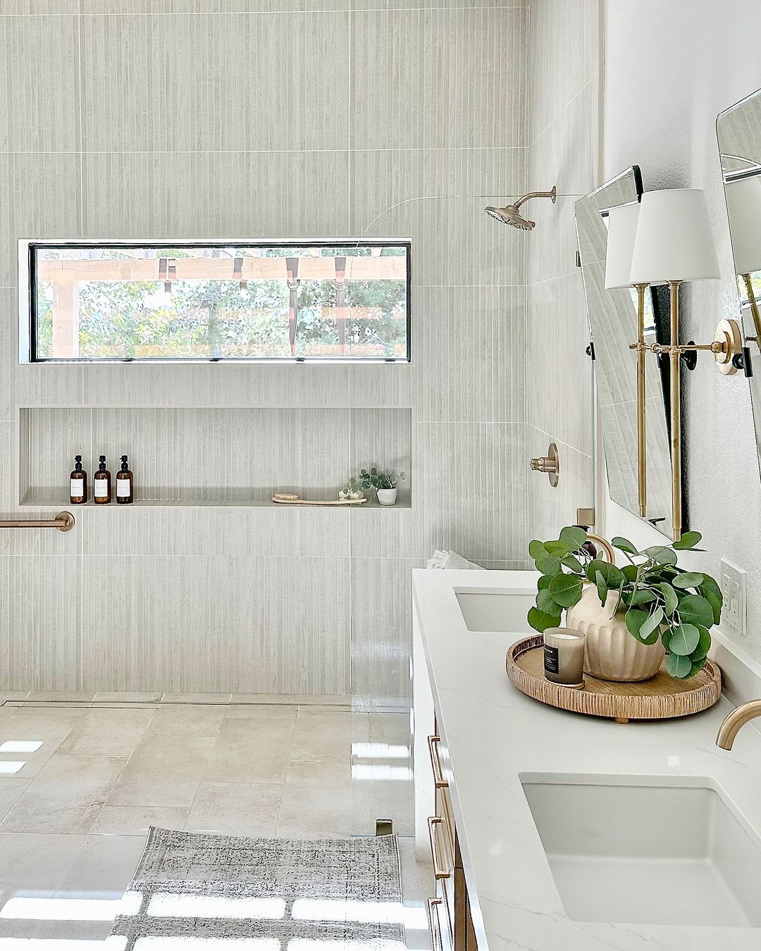 Spacious Neutral Shower with Large Niche and Gold Fixtures