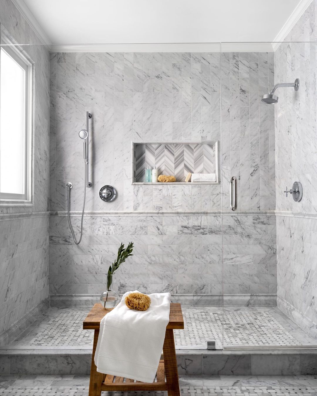 Sophisticated Marble Shower Pan with Chevron Niche