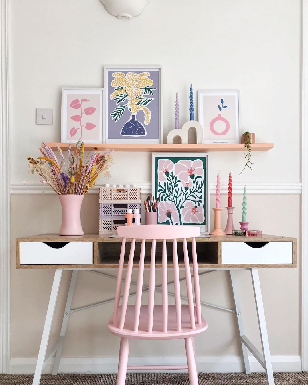 Vibrant and Cheerful Workspace with Pastel Picture Ledge