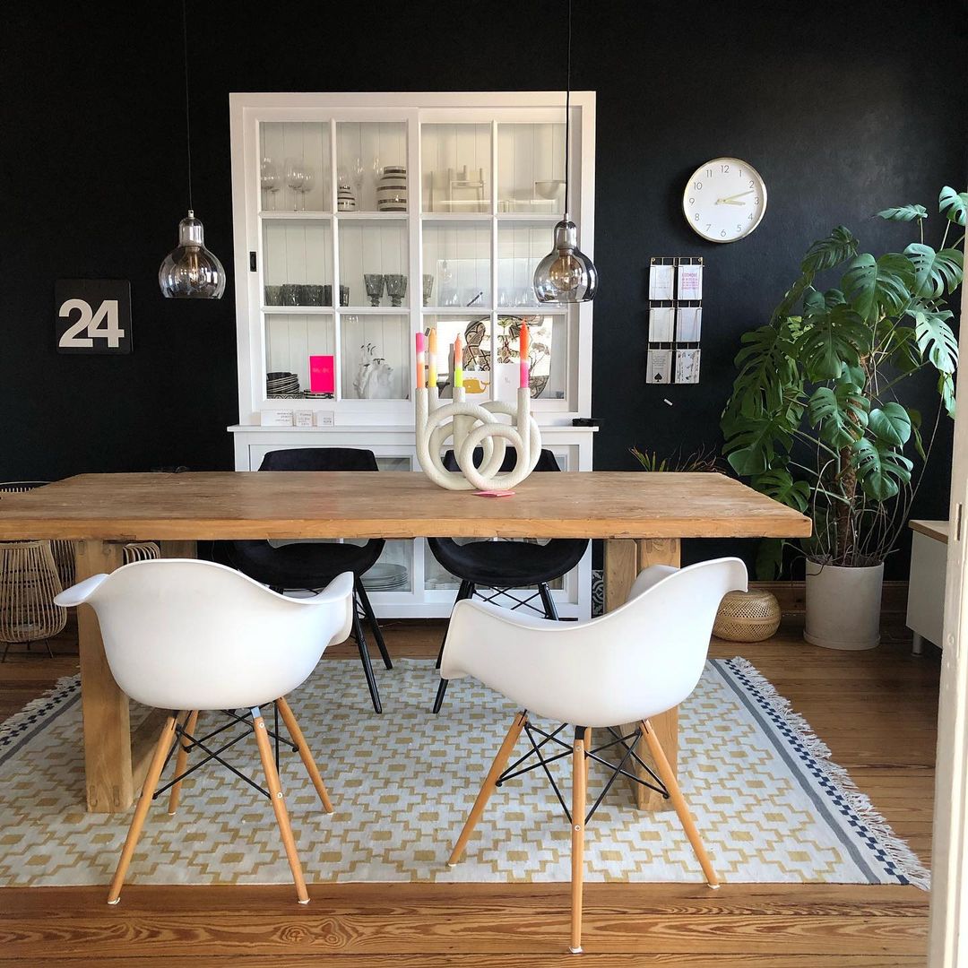 Contemporary Dining Room with Dark Wall