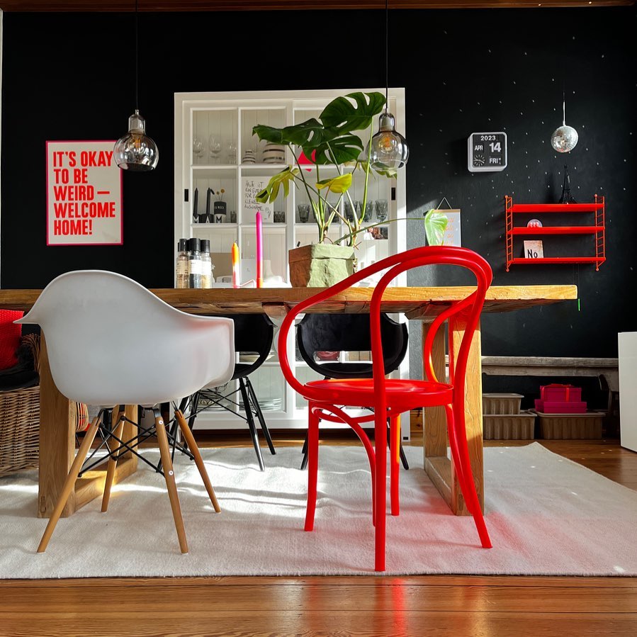 Eclectic Dining Area with Bold Black Backdrop