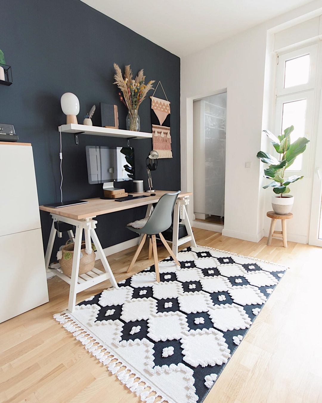 Minimalist Home Office with Bold Black Wall