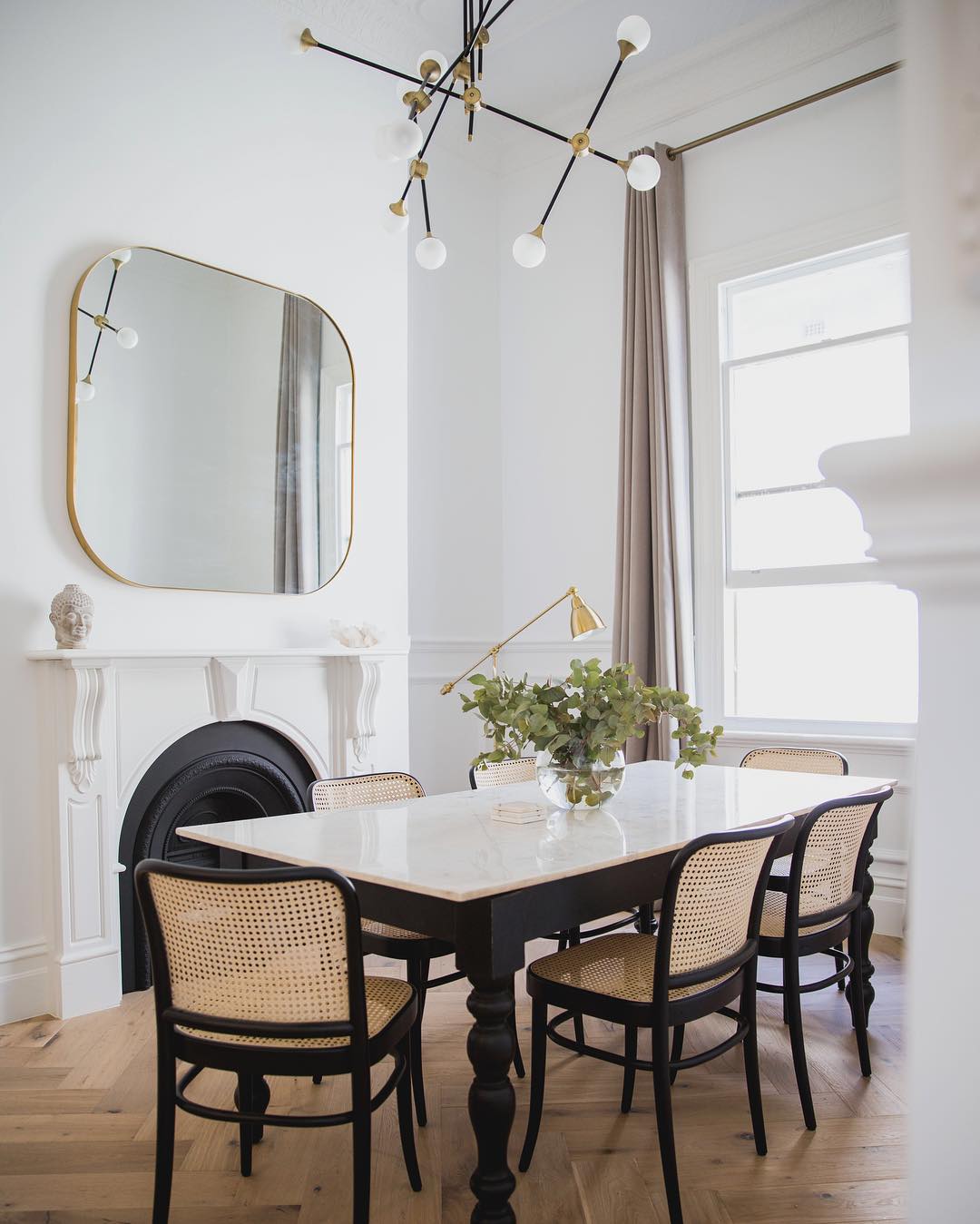 Chic Dining Room with Curved Mirror