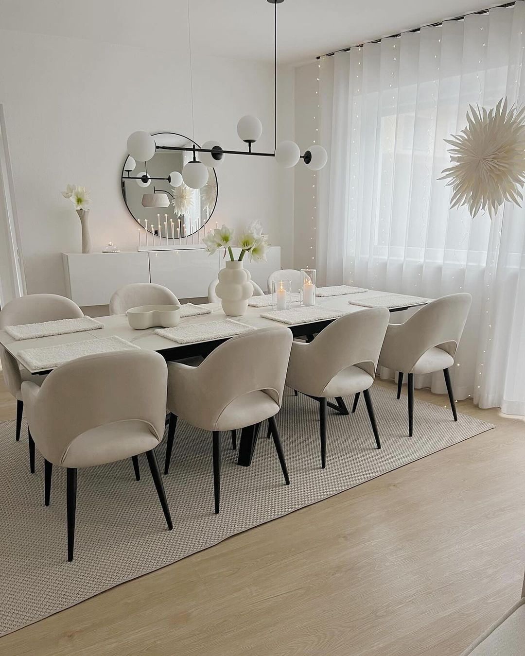 Minimalist Dining Room with Round Mirror