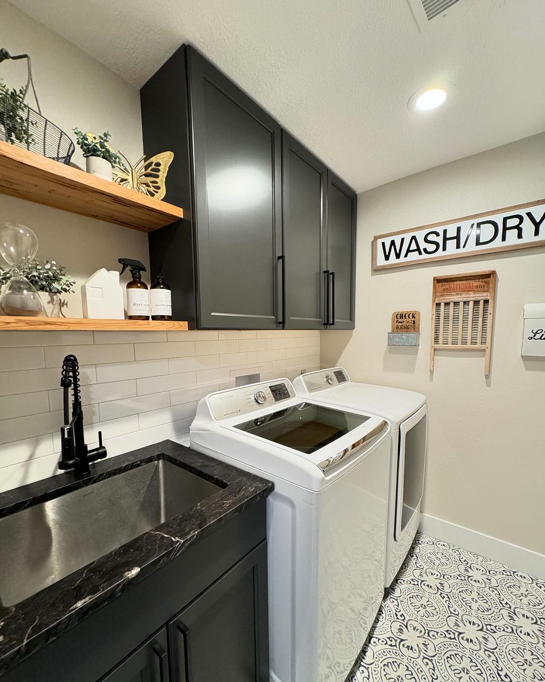 Contemporary Laundry Room with Dark Cabinets and Patterned Floor