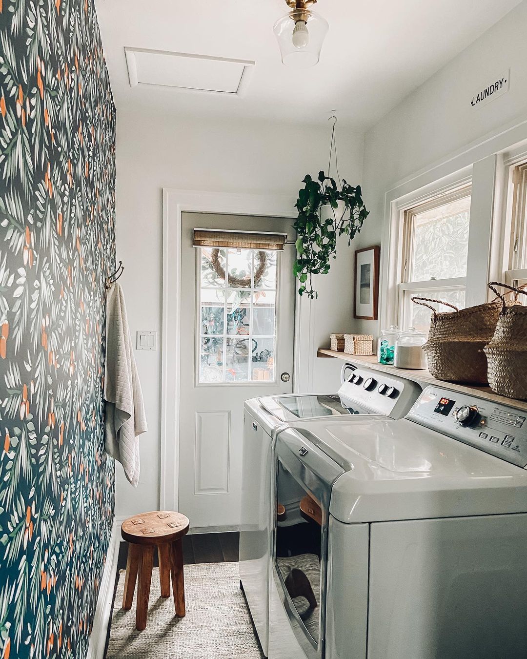 Vibrant Laundry Room with Bold Wallpaper and Natural Light