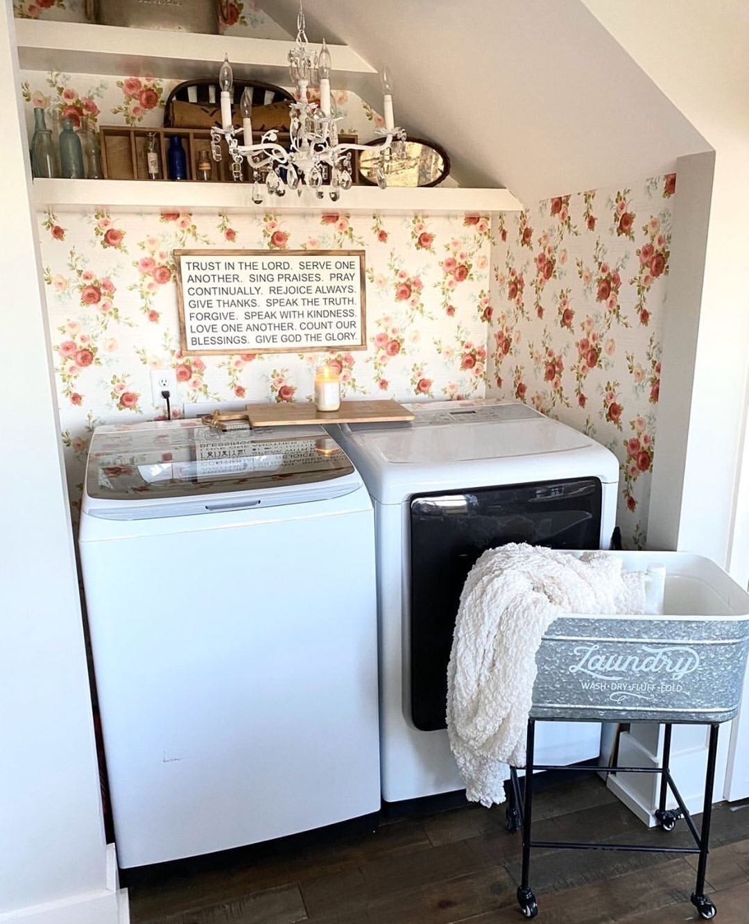 21. Charming Laundry Room with Floral Wallpaper and Chandelier